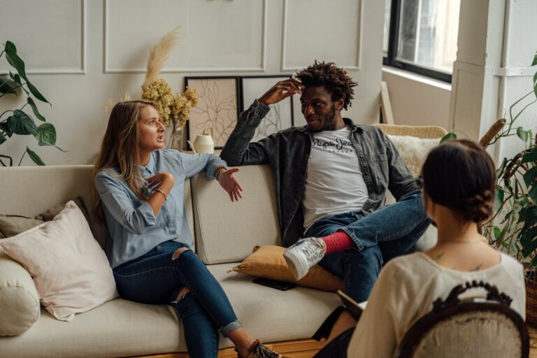 Couples participating in a therapy session, emphasizing personalized treatment plans.