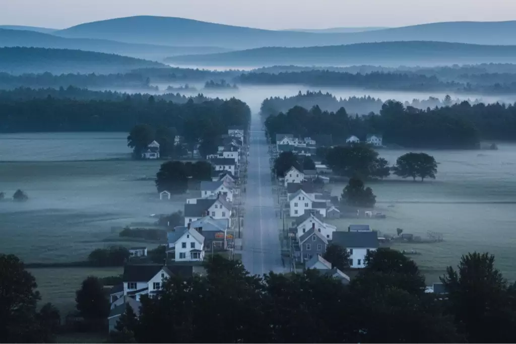 Small New Hampshire town at sunrise, symbolizing the hidden heroin crisis in rural communities