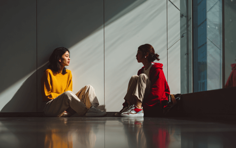 Two adults having a calm, private conversation about relapse and recovery